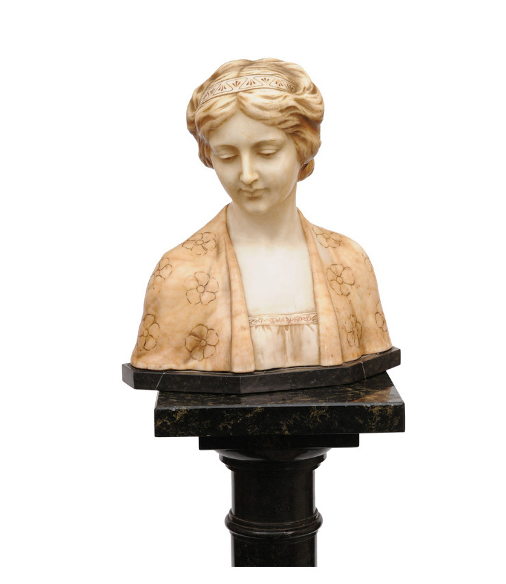 A mable bust of a young girl on high column