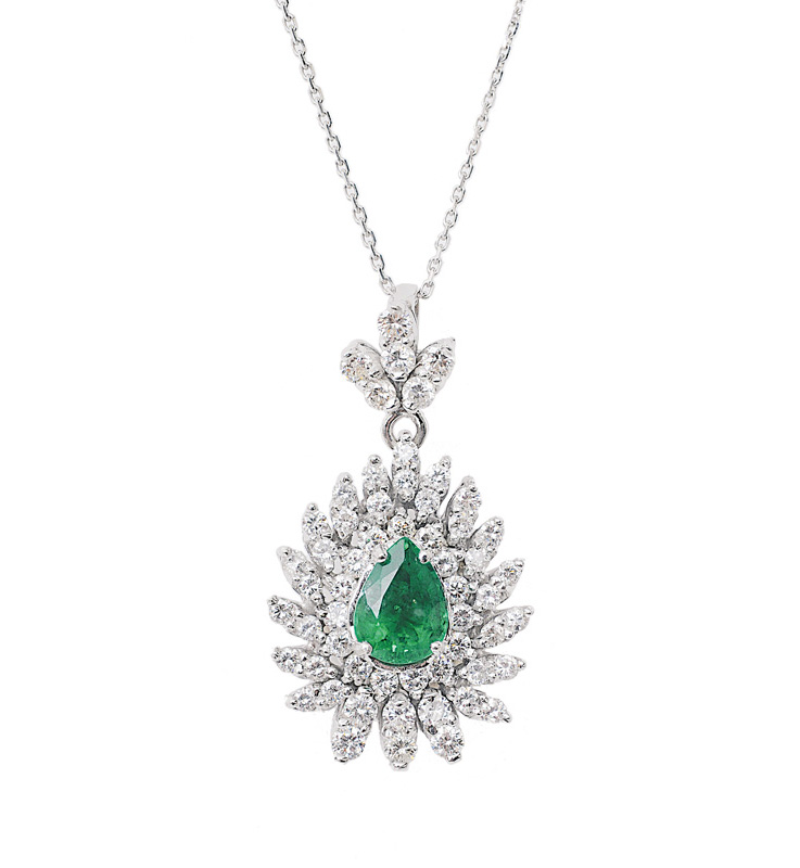 A pearshaped emerald diamond pendant