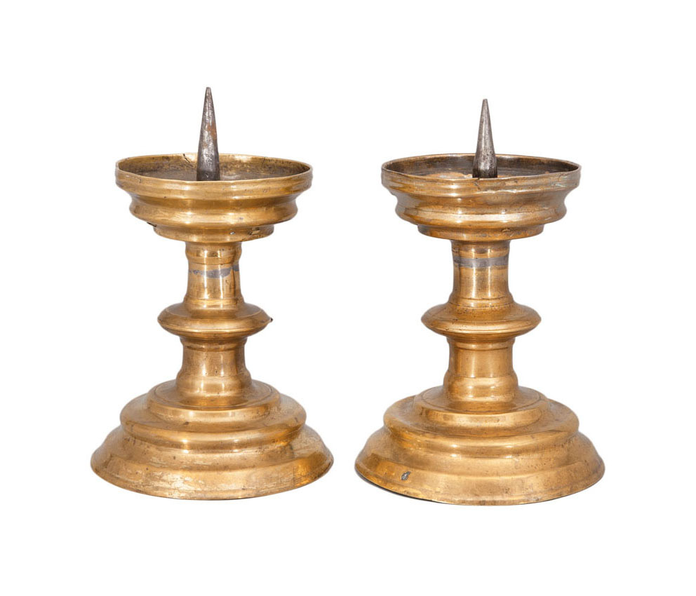 A pair of small late gothic candle holders