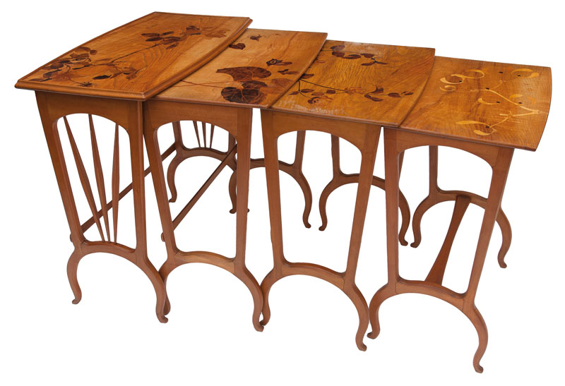 A set of four Art Nouveau tables with floral intarsia