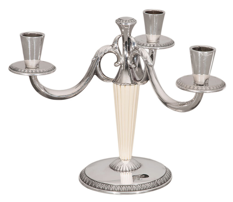 An Art Deco candle holder with ivory ornaments
