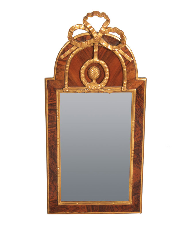 A Louis Seize mirror with ornaments of bows