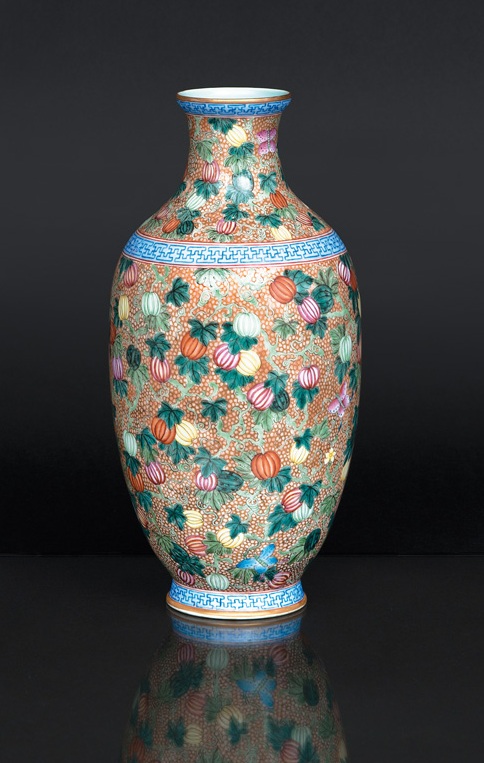A magnificent baluster vase with melons and butterflies