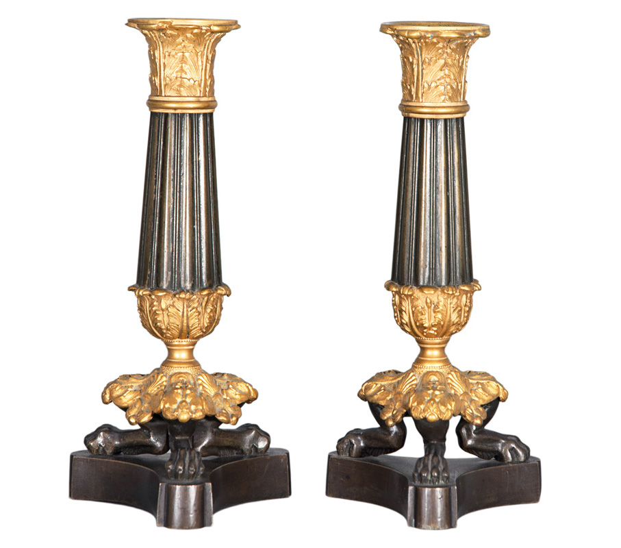 A pair of classical candlesticks aux Pattes de Lions