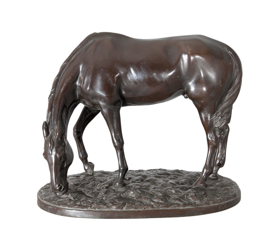 A rare early bronze figure 'Grazing horse'