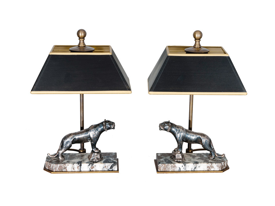 A pair of table lamps with silvered tiger figures