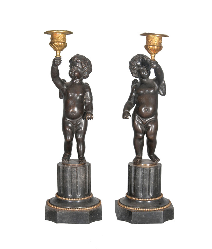 A pair of Napoleaon III candlesticks with Cupid