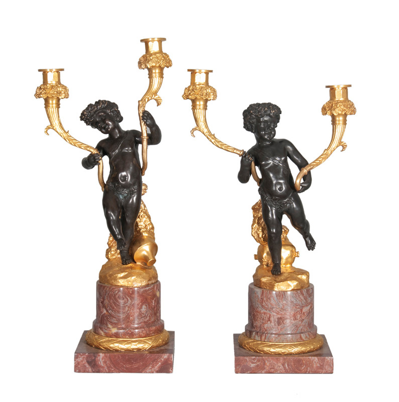 A pair of hug candelabras with bacchants