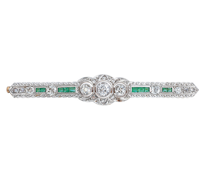 A small Art-Déco brooch with emeralds and diamonds