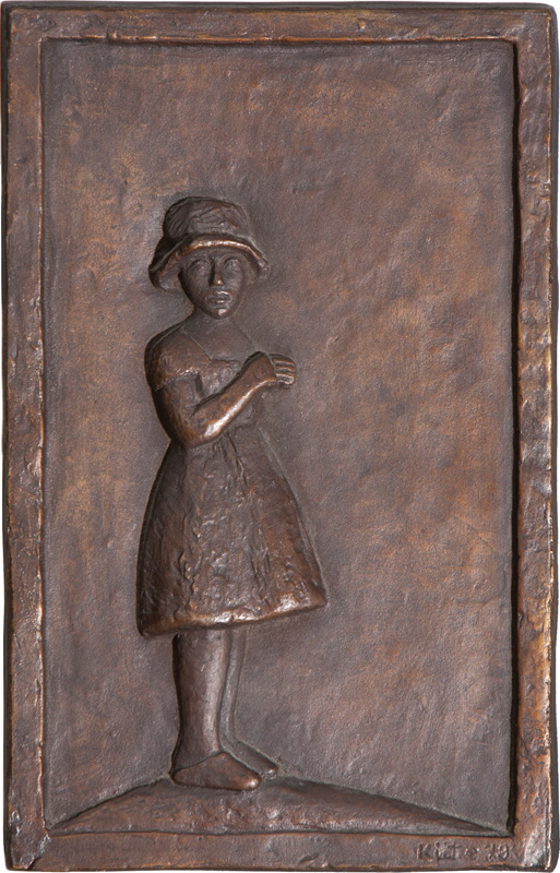 A bronze relief 'Girl with hat'