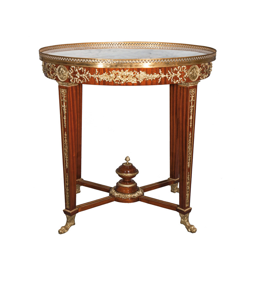 An elegant table with magnificent bronze applications