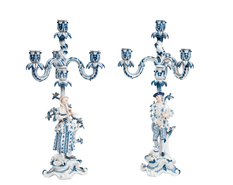 A tall pair of candelabras with shepherd's couple