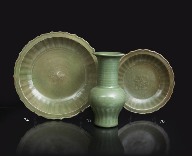 A large celadon plate with barbed rim