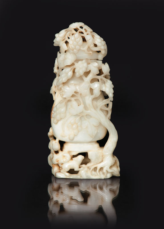 A russet and white jade vase with 'squirrel and grapes' decoration