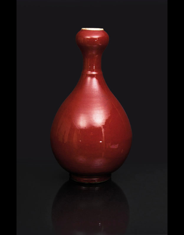 An unusual tall 'Sang-de-Boeuf' vase with garlic-neck