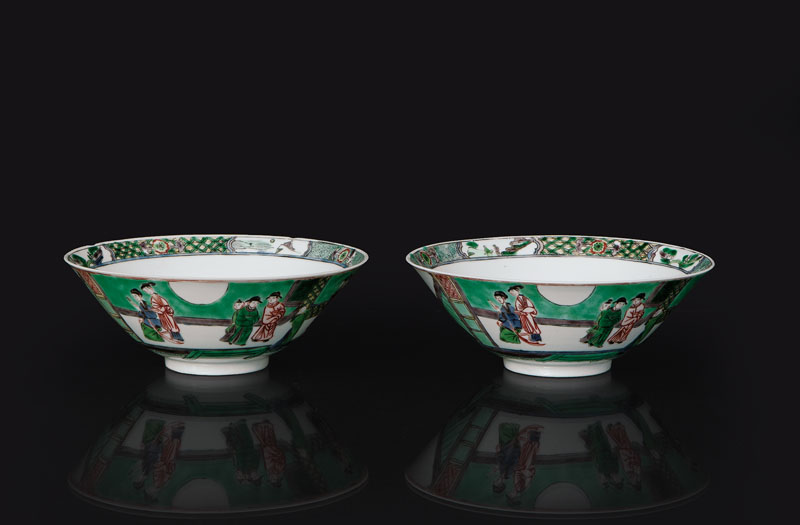 A pair of 'Famille Verte' bowls with genre scenes