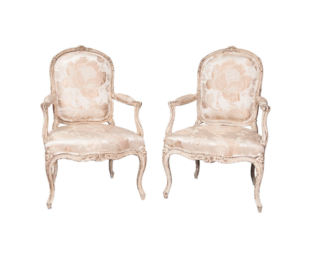 A pair of painted armchairs of Baroque style