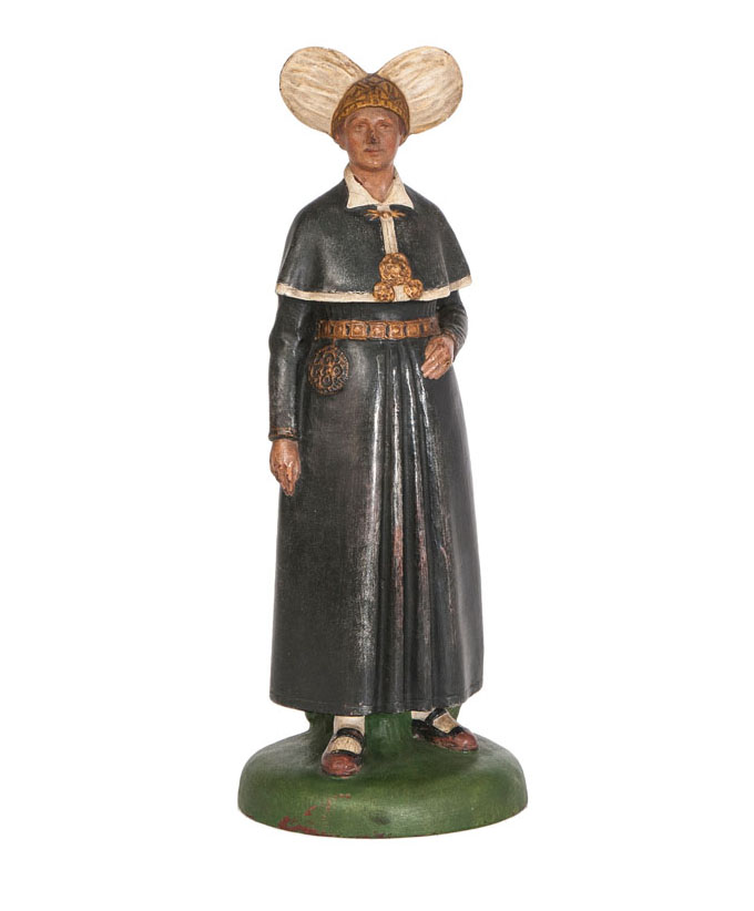 A ceramic figure 'Peasant woman in local costume'