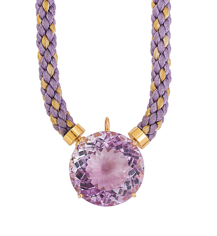 An amethyst pendant with silk cord necklace