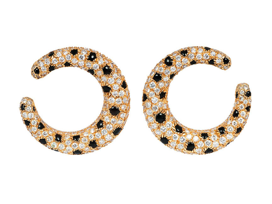 A pair of diamond onyx earclips by Cartier