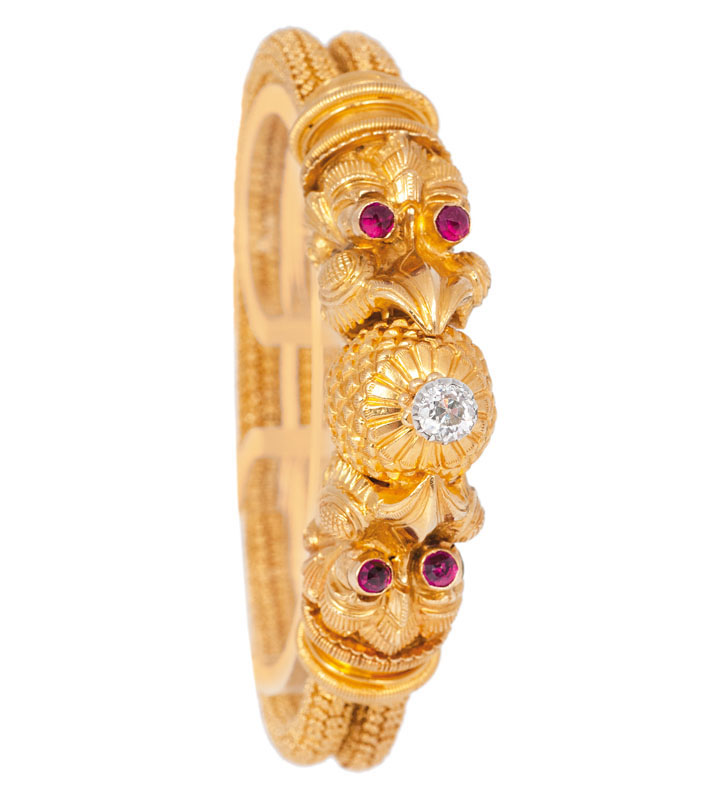 A golden bracelet with old cut diamonds and rubies in the style of the antique era A golden bracelet with old cut diamonds and rubies in the style of the antique era