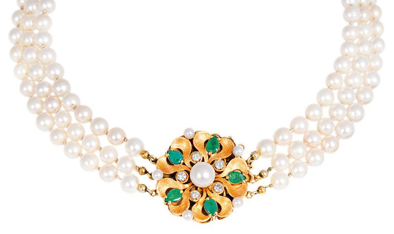 A pearl necklace with emerald diamond clasp