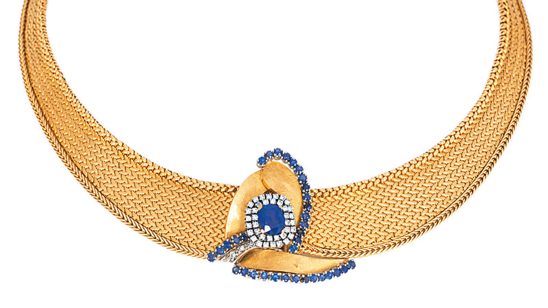 A golden necklace with sapphire diamond setting