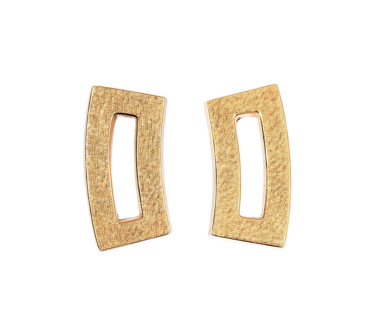 A pair of earclips in gold