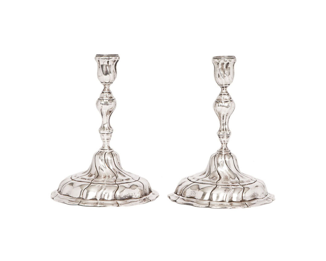 A pair of candlesticks of Baroque style