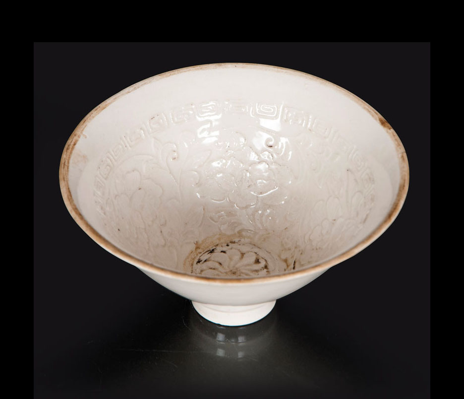 A small conical bowl with peonies