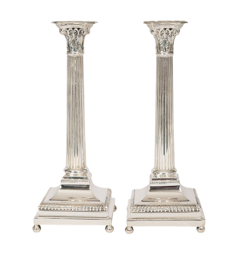 A pair of high candlesticks of classical column shape