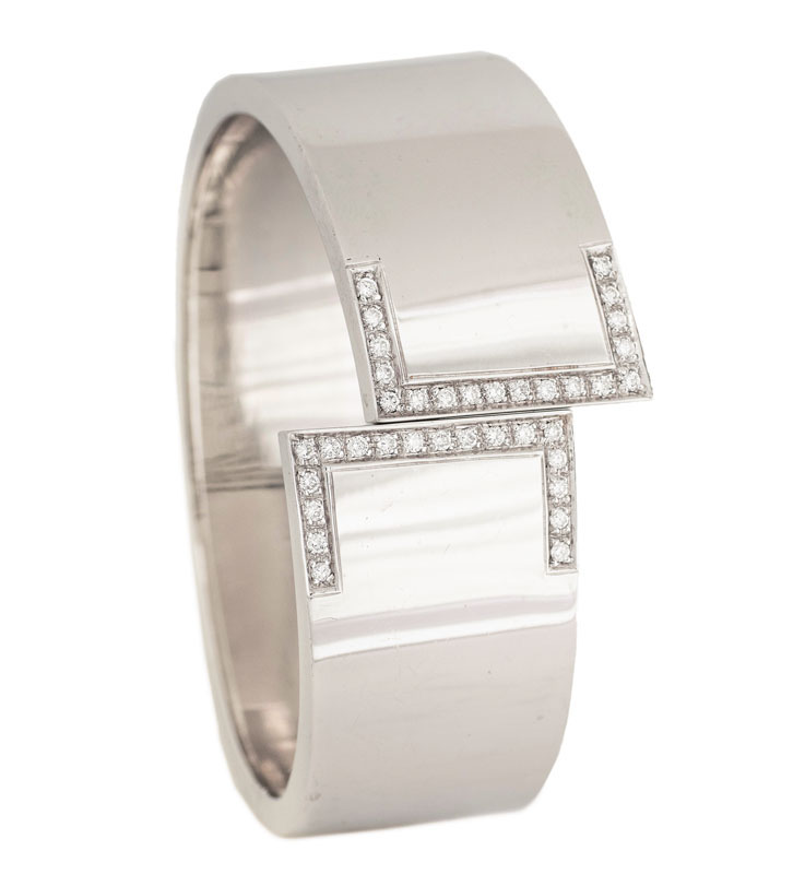A golden bangle bracelet with diamonds A golden bangle bracelet with diamonds