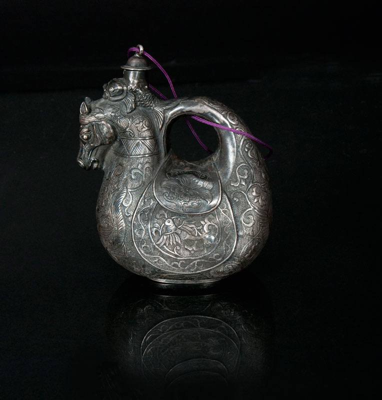 A pilgrim's silver flask in form of a horse