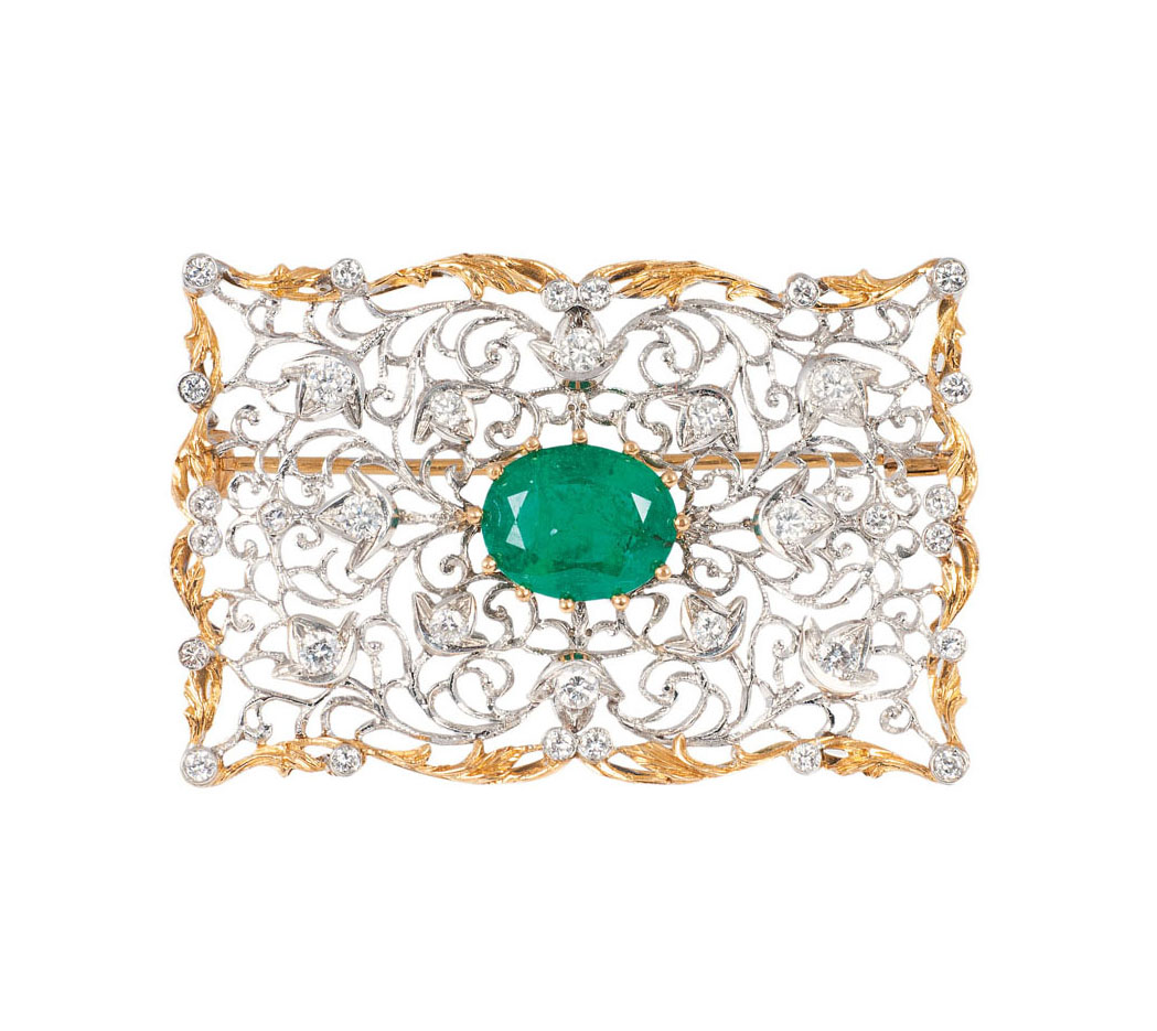 An emerald diamond brooch