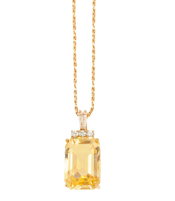 A yellow sapphire diamond pendant with necklace