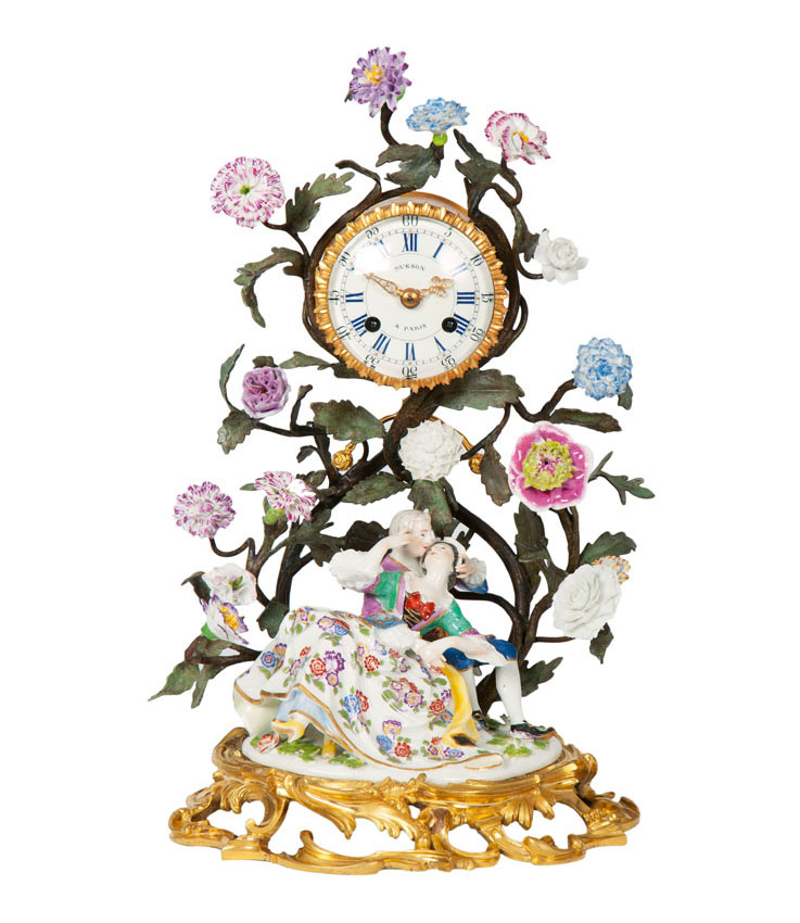 A very important ormolu mantel clock with Meissen 'kissing group'