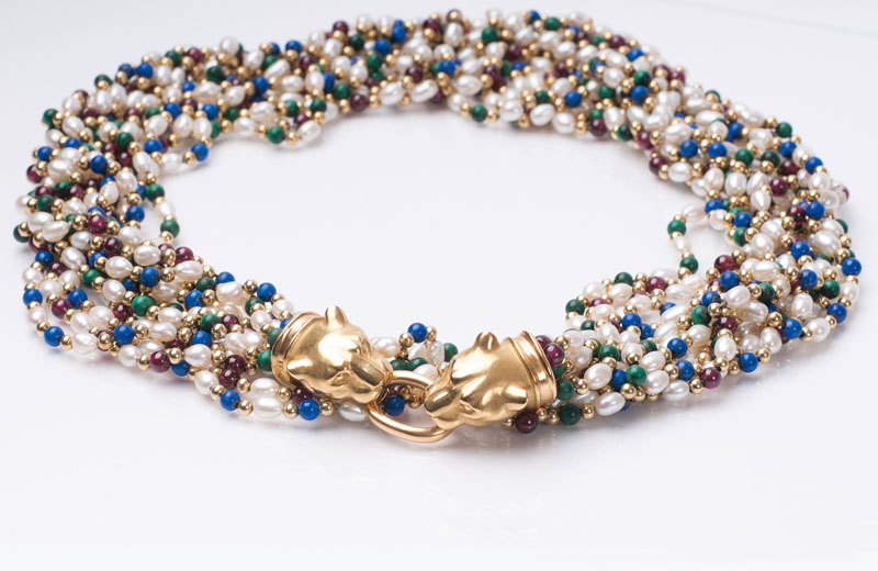 A long pearl necklace with lapis lazuli and malachite