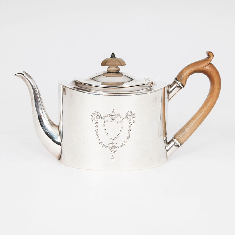 A tea pot with classical engraved pattern