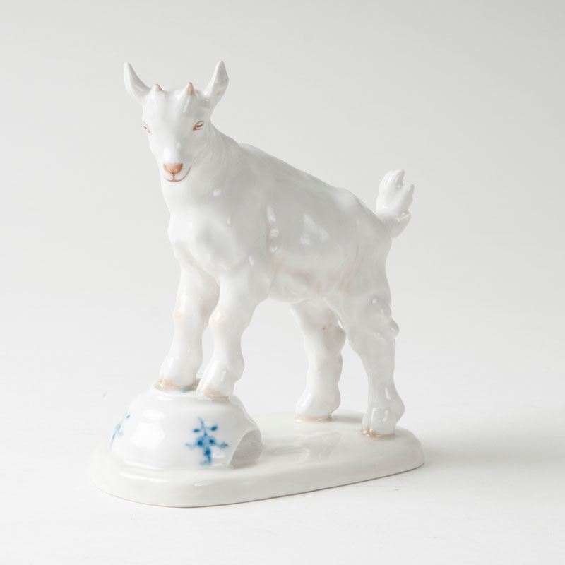An animal figure 'billy goat on a cup'