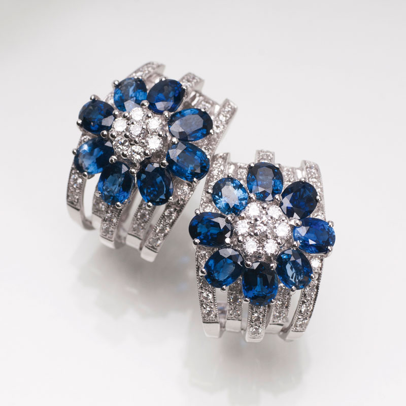 A pair of sapphire diamond earrings with flowers