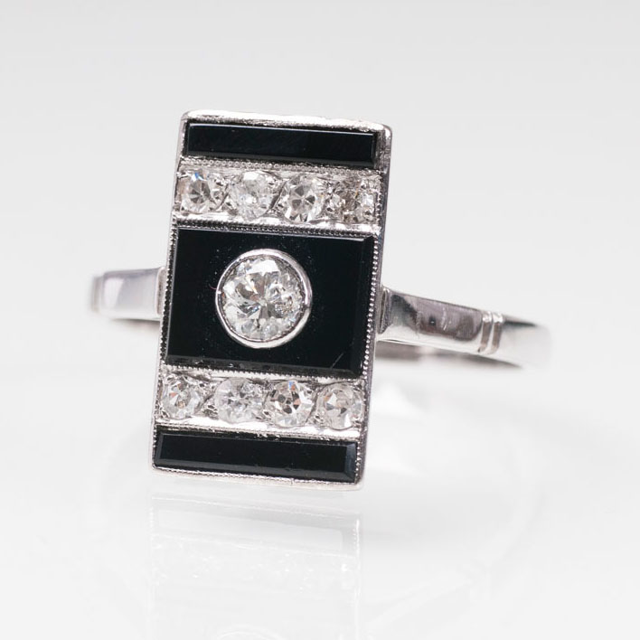 An onyx diamond ring with matching earpendants