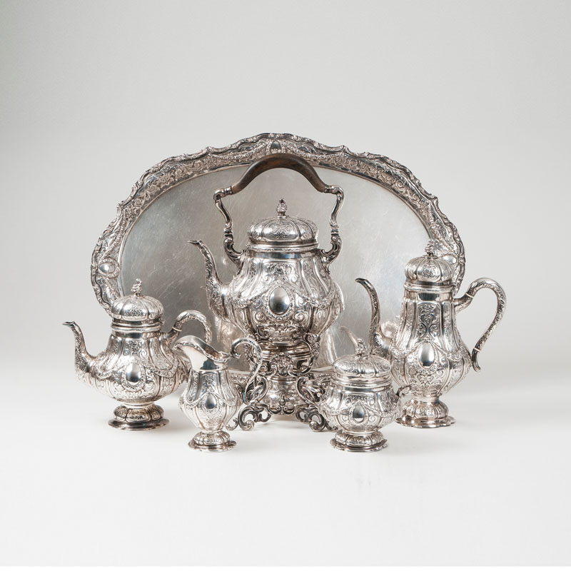A heavy silver coffee and tea service