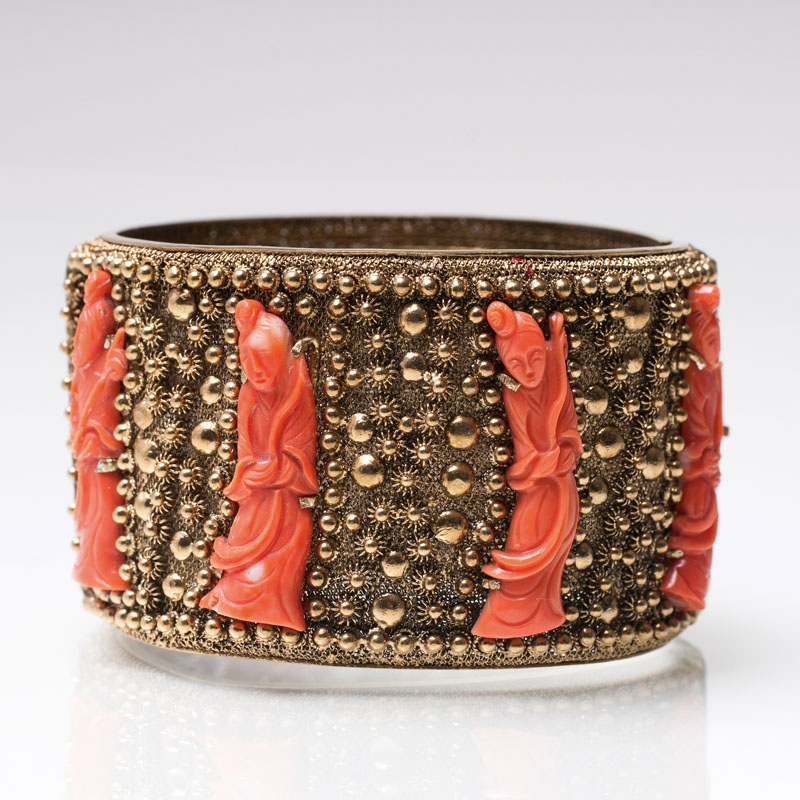 A bangle bracelet with coral 'Guanyin'