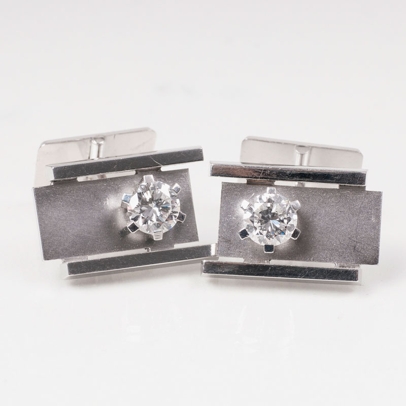 A pair of cufflinks with solitaire diamonds