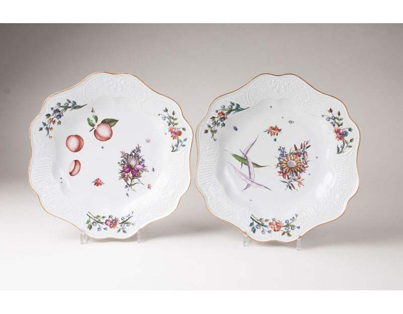 A pair of large plates with flower and fruit painting