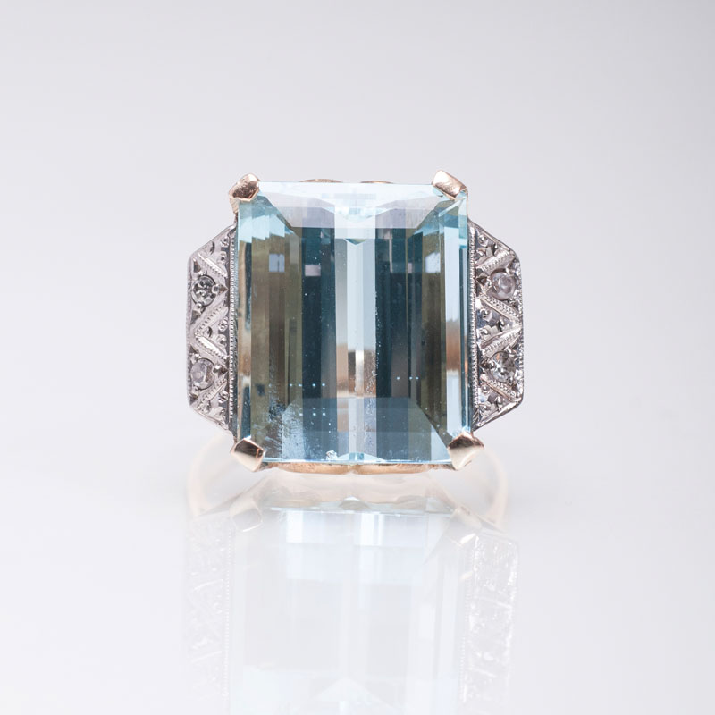 An aquamarine diamond ring