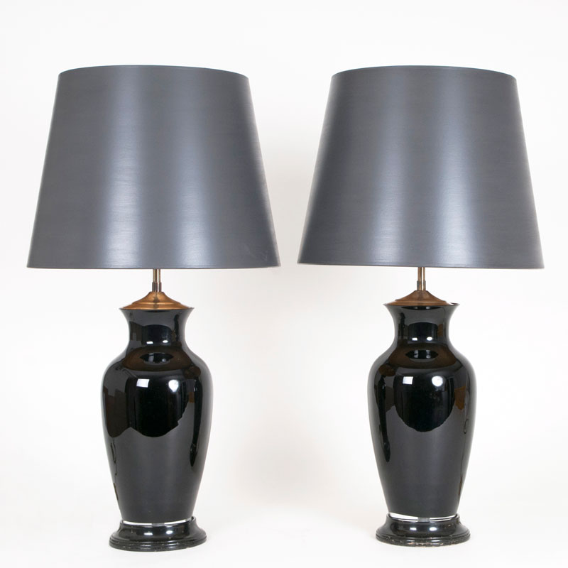 A pair of large glass table lamps