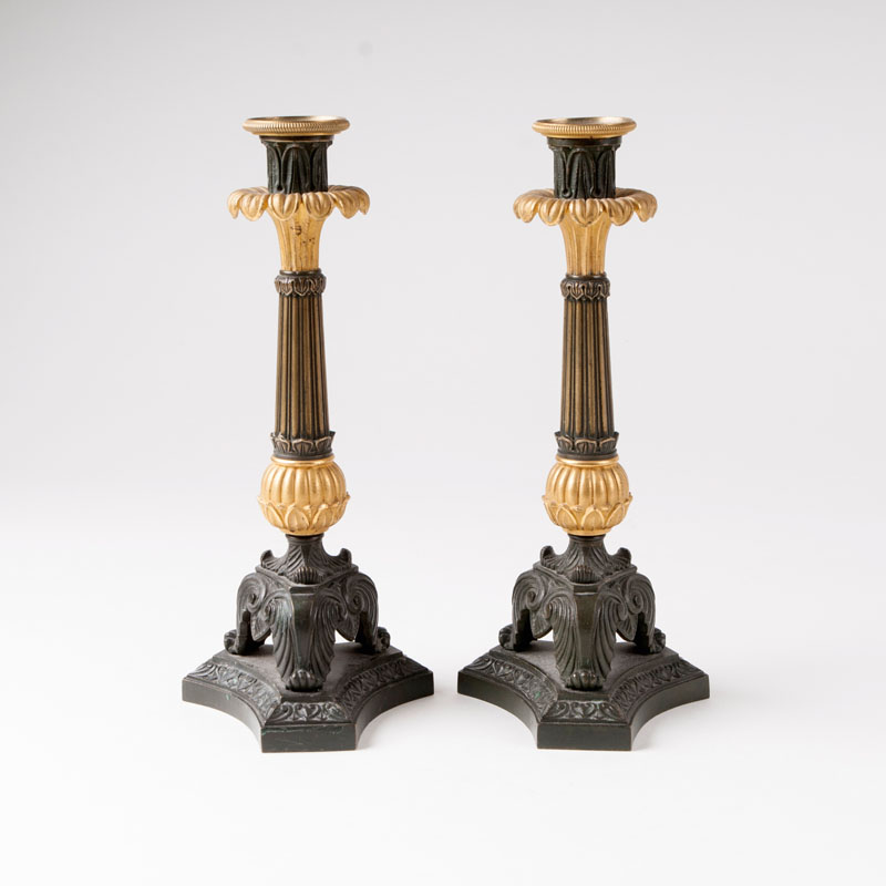 A pair of decorative candlesticks in the style of Charles X.