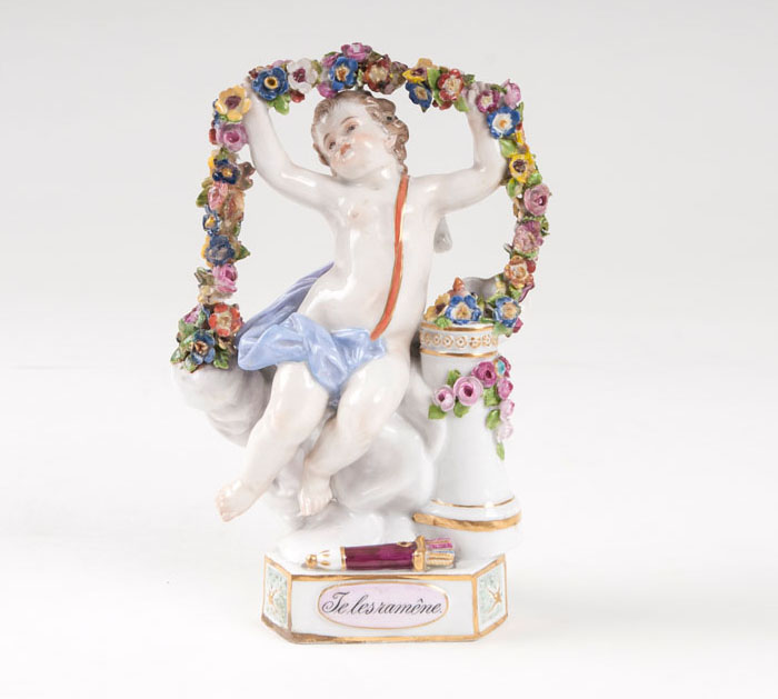 A porcelain figure 'motto' child 'Je les ramène'