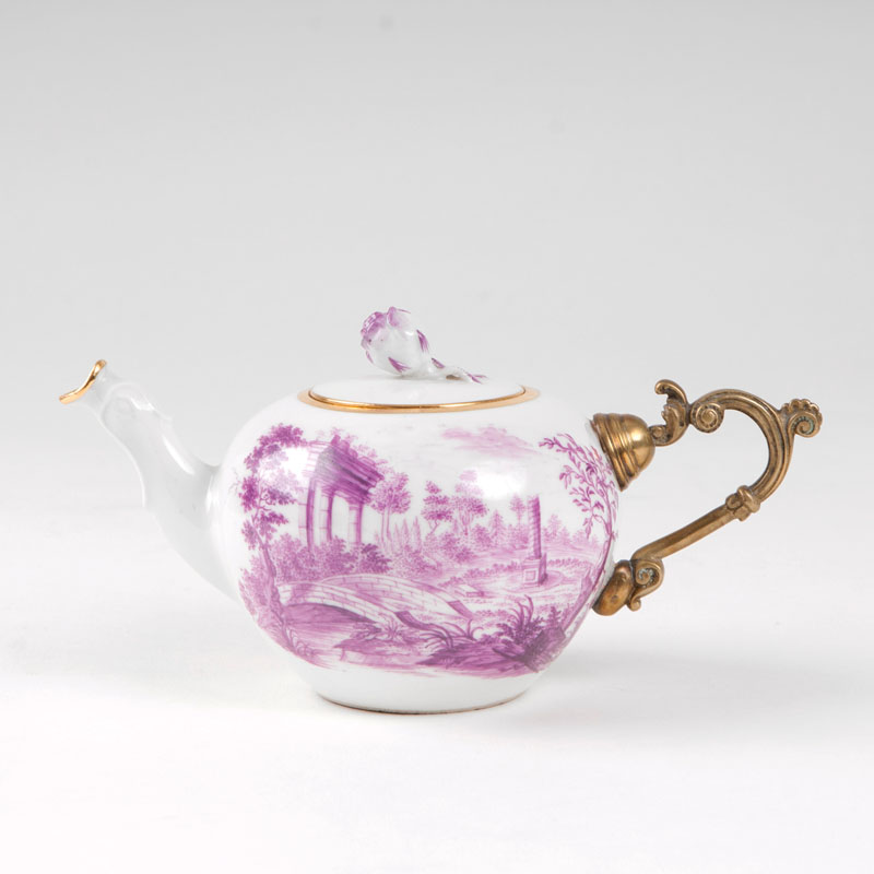A teapot with landscape painting in purple monochrome